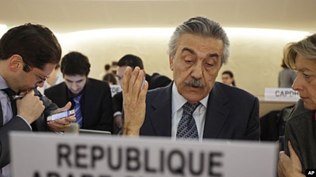 Syria's Ambassador Faysal Khabbaz Hamoui (C) gestures during a Human Rights Council special session on the situation in Syria at the United Nations in Geneva, December 2, 2011.