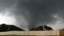A tornado moves past homes in Moore, Oklahoma, May 20, 2013.