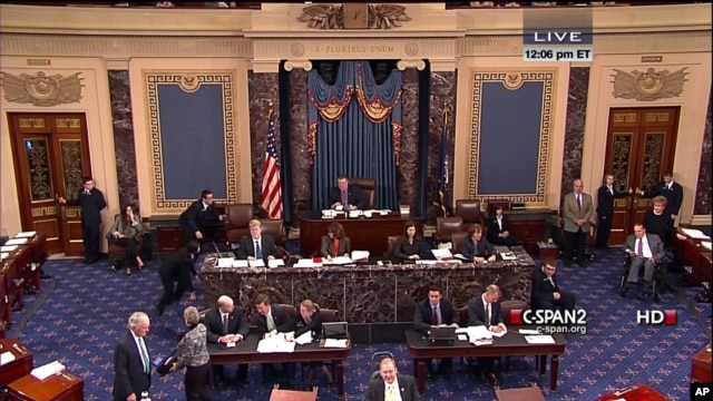 This handout video image shows former Senate Majority Leader Bob Dole, right, in the Senate Chamber on Capitol Hill, Dec. 4,2012, by his wife Elizabeth Dole. Frail and in a wheelchair, Dole was a startling presence on the Senate floor as lawmakers voted on a treaty on disabilities.
