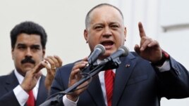 FILE - Venezuelan Vice President Nicolas Maduro (L) listens to National Assembly President Diosdado Cabello speak during the assembly inauguration in Caracas, January 5, 2013.