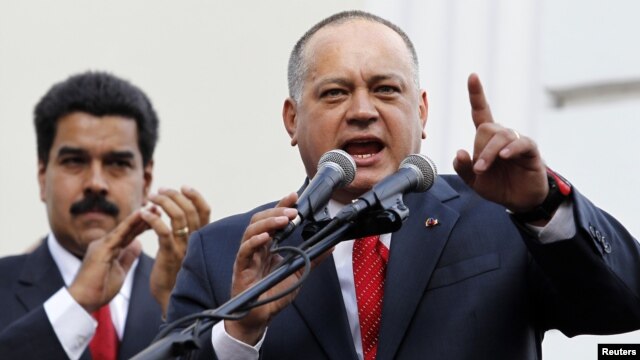 FILE - Venezuelan Vice President Nicolas Maduro (L) listens to National Assembly President Diosdado Cabello speak during the assembly inauguration in Caracas, January 5, 2013.