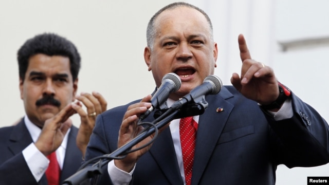 Venezuelan Vice President Nicolas Maduro (L) listens to National Assembly President Diosdado Cabello speak during the assembly inauguration in Caracas, January 5, 2013.