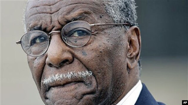In this June 2007 file photo, Civil rights activist the Rev. Fred Shuttlesworth departs the Federal Courthouse in Montgomery, Alabama.
