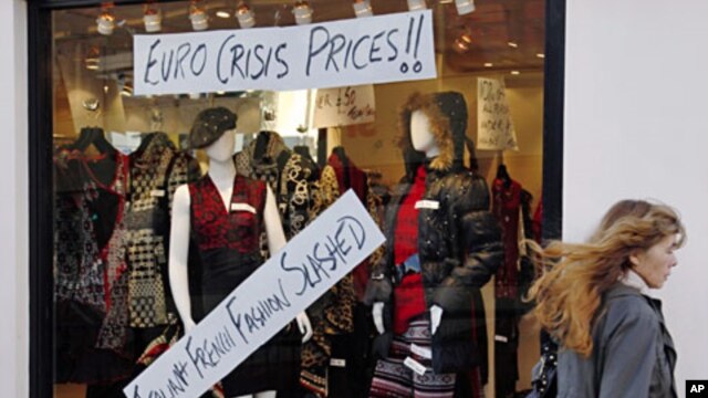 A pedestrian passes a shop in Brighton southern England, December 15, 2011