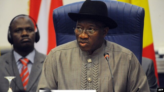 Nigerian President Goodluck Jonathan reads his opening address during an ECOWAS Summit gathering west African leaders to plot a military strategy to wrest control of northern Mali from Islamist groups as fears grow over the risks they pose to the region a