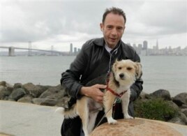 This 2011 photo shows Timothy Ray Brown, the only man ever known to have been apparently cured from AIDS, with his dog, Jack, on Treasure Island in San Francisco. (Courtesy Photo)