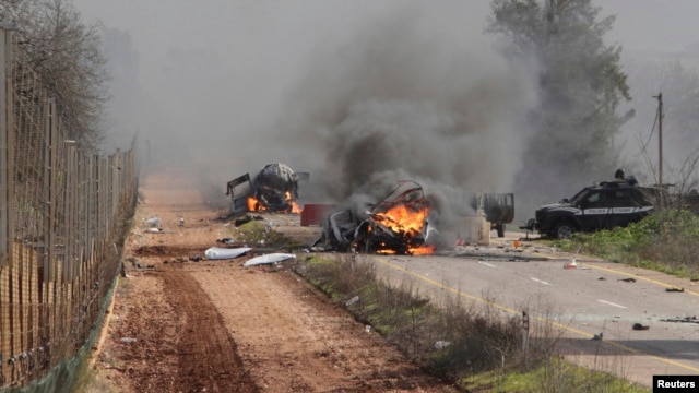 Hezbollah claimed responsibility for an attack Wednesday on an Israeli military convoy. Burning vehicles are seen near the village of Ghajar on Israel's border with Lebanon, Jan. 28, 2015.  