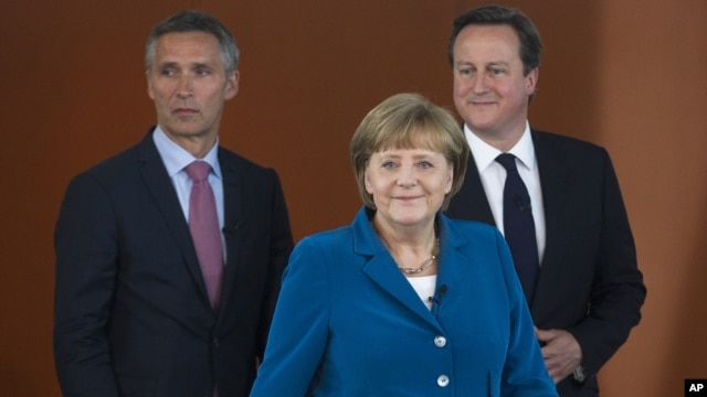 German Chancellor Angela Merkel, center, British PM David Cameron, right, and Norway's PM Jens Stoltenberg, left, arrive for a panel discussion in Berlin, Germany, June 7, 2012.