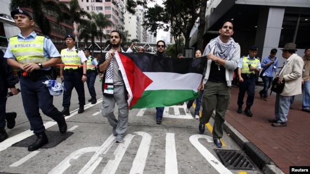 Người biểu tình thân Palestine xuống đường phản đối việc Israel ném bom Dải Gaza. 