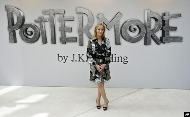 FILE - British author J.K. Rowling poses for photographers as she announces her new website project Pottermore at the Victoria and Albert Museum in London, June 23, 2011