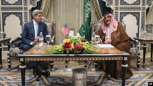 U.S. Secretary of State John Kerry meets with Saudi Foreign Minister Prince Saud al-Faisal at the Royal Terminal of the King Abdulaziz International Airport in Jiddah, Saudi Arabia, Thursday, Sept. 11, 2014.