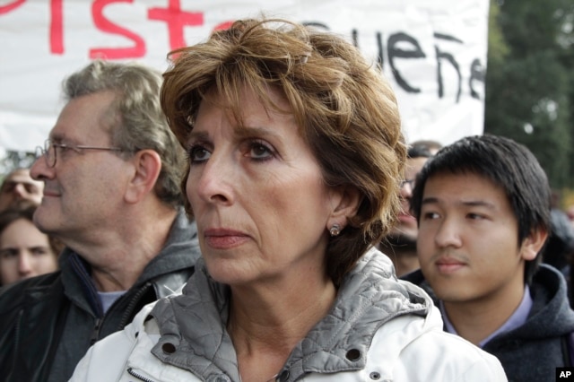 FILE - University of California, Davis Chancellor Linda Katehi waits to speak during a rally on campus in Davis, Calif., Nov. 21, 2011 after police pepper-sprayed peaceful demonstrators during a protest near the same spot on Friday.
