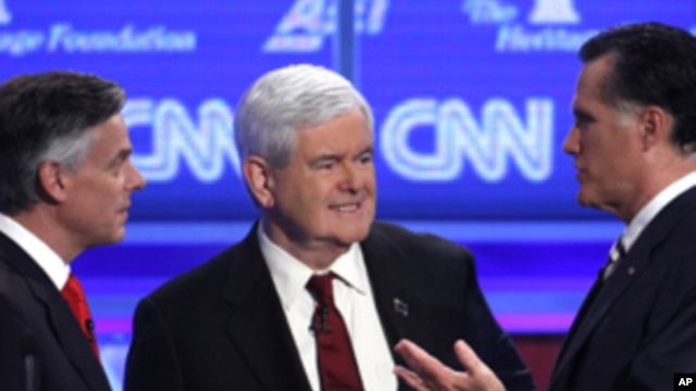 (From left) Republican presidential candidates former Utah Gov. Jon Huntsman, former house speaker Newt Gingrich and former Massachusetts governor Mitt Romney at a Republican presidential debate in Washington, Tuesday, Nov. 22, 2011.