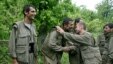 Kurdish fighters from the Kurdistan Workers Party (PKK) congratulate each other after arriving in the Heror area, northeast of Dahuk, 260 miles (430 kilometers) northwest of Baghdad,  May 14, 2013. 