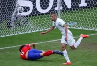 Algeria's Islam Slimani (R) runs past South Korea's Kim Young-gwon as he celebrates scoring a goal during their 2014 World Cup Group H soccer match at the Beira Rio stadium in Porto Alegre.  