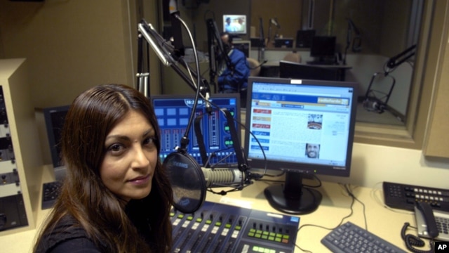 Radio Farda producer Sara Valinejad sits in the studio, Oct. 11, 2006, in Springfield, Virginia.