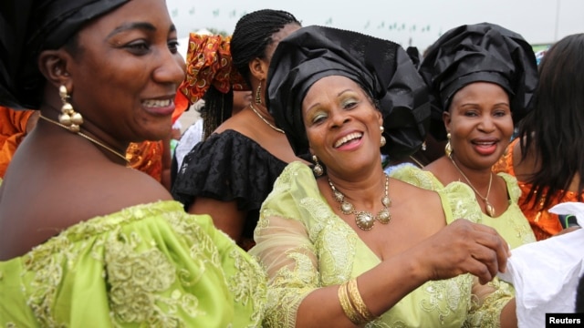 FILE - Delegates from Delta state take part in a parade during the 