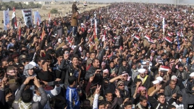 Protesters chant slogans against Iraq's Shiite-led government during a demonstration in Fallujah, Jan. 4, 2013.