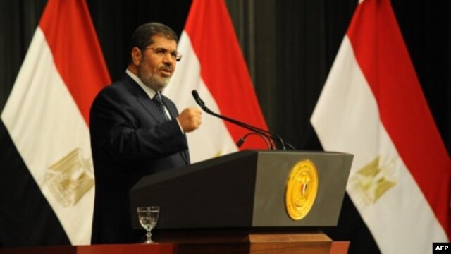 FILE - Egyptian President Mohamed Morsi addresses a conference June 26, 2013 in Cairo (Egyptian Presidency photo)