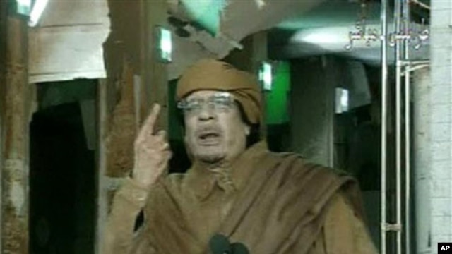 This image broadcast on Libyan state television, February 22, 2011, shows country's leader Moammar Gadhafi reportedly addressing the nation from Tripoli
