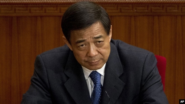 Then Chongqing party secretary Bo Xilai attends a plenary session of the National People's Congress at the Great Hall of the People in Beijing, March 11, 2012.  