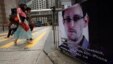 A poster supporting Edward Snowden, a former contractor at the National Security Agency who leaked revelations of U.S. electronic surveillance, is displayed at Hong Kong's financial Central district June 17, 2013.