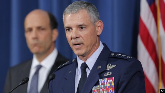 Commander of U.S. Forces in Japan Lt. Gen. Salvatore Angelella, right, speaks to the media next to U.S. Ambassador to Japan John Roos at the U.S. Embassy in Tokyo, Oct. 19, 2012.