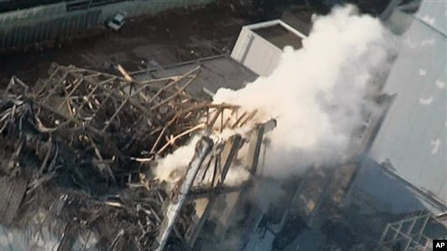Smoke billows from wrecked unit 3 at Japan's crippled Fukushima Daiichi nuclear power plant in Okumamachi, Fukushima Prefecture, March 16, 2011