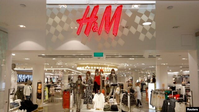 The company logo is placed at the flagship store of H&M, Hennes & Mauritz, HMb.ST, the world's second-biggest fashion retailer in Sweden's capital Stockholm, file photo.