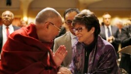 Dalai Lama at the National Prayer Breakfast meeting with White House senior adviser Garrett handshake
