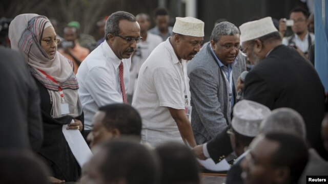 New parliamentarians are sworn-in during an inauguration ceremony for members of Somalia's first parliament in 20 years in Mogadishu, August 20, 2012.