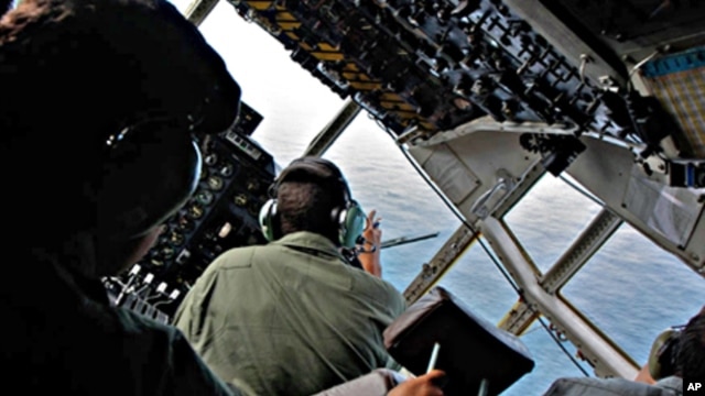Brazilian Air Force officers look for signs of Air France flight 447 as they patrol the crash area in the open Atlantic Ocean some 745 miles (1,200 km) northeast of Recife (file photo)