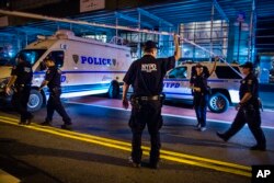 Police arrive at the scene of an explosion in the Chelsea neighborhood in New York, Saturday, September 17, 2016.