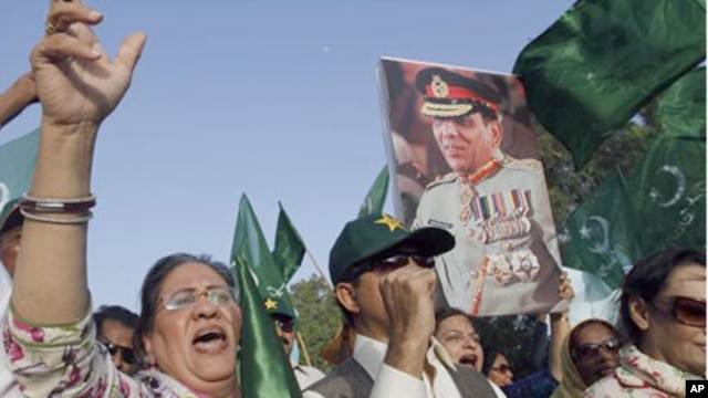 Supporters of political party Pakistan Muslim League hold a picture of army chief Gen. Ashfaq Parvez Kayani in Karachi, Pakistan. Pakistan's intelligence chief, Gen. Ahmed Shuja Pasha, admitted "negligence" on the part of authorities in failing to find bi