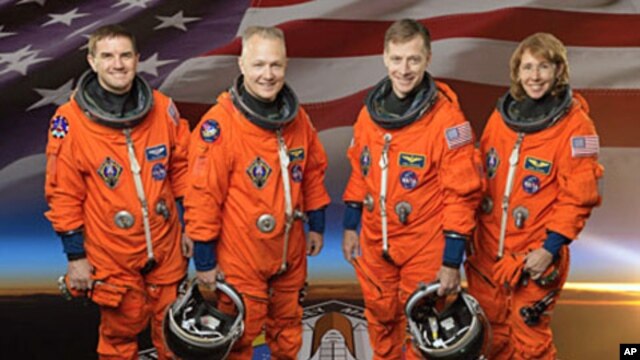 Shuttle Atlantis' final mission will include mission commander Chris Ferguson (CR), pilot Doug Hurley (CL), and mission specialists Rex Walheim and Sandy Magnus