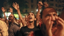 Protesters shout during a demonstration against presidential candidates Mohamed Morsi and Ahmed Shafiq at Tahrir Square in Cairo May 28, 2012.