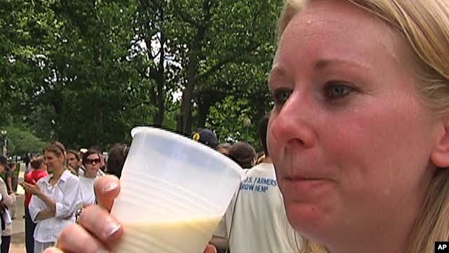 A woman enjoys a cup of raw unpasteurized milk