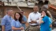 President Barack Obama views the devastation at  Plaza Towers Elementary School caused by tornado and severe weather last week with school officials, May 26, 2013, in Moore, Oklahoma.