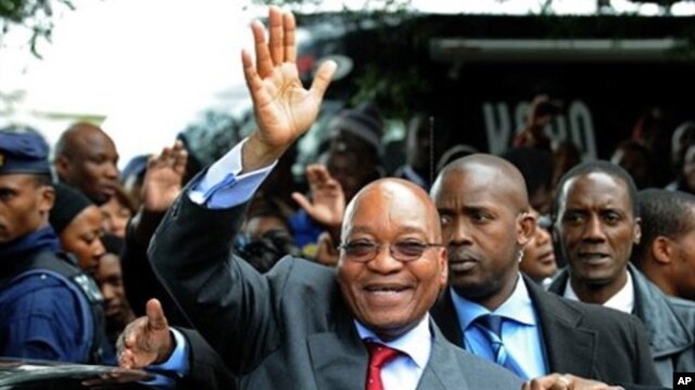 South African President Zuma waves as he arrives to declare his HIV-negative status during launch of the HIV Counselling and Testing Campaign held at Natalspruit Hospital in Katlehong, 25 April 2010