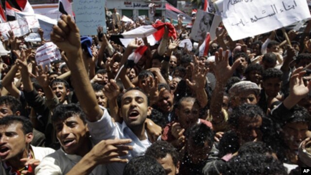 Anti-government protesters shout slogans during a protest demanding the ouster of Yemen's President Ali Abdullah Saleh outside Sana'a University March 1, 2011
