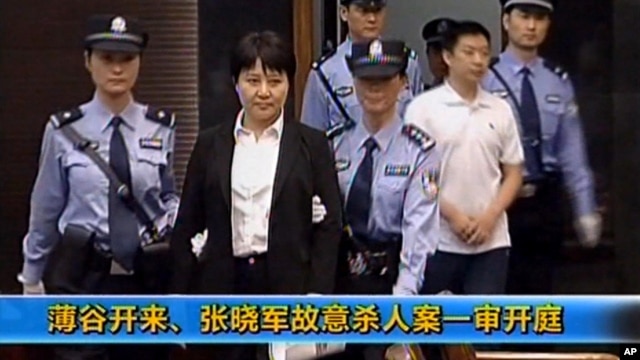This video image taken from CCTV shows Gu Kailai, second left, being taken to court in the eastern Chinese city of Hefei, August 9, 2012. 