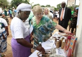 Michelle Bachelet, Executive Director of UN Women, views local products made and sold in Totota, Liberia (March 7, 2011). She was visiting the country to commemorate the 100th anniversary of International Women's Day.