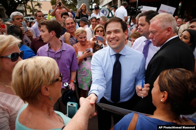 In this March 11, 2016, photo, Republican presidential candidate, Sen. Marco Rubio, R-Fla. greets supporters in Naples, Fla.