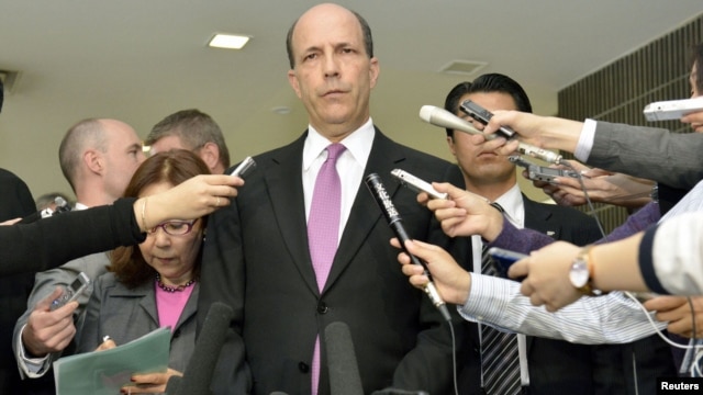 U.S. Ambassador to Japan John Roos (C) delivers a statement after a meeting with Japan's Senior Vice Foreign Minister Shuji Kira (not in picture) at the Foreign Ministry in Tokyo, in this photo by Kyodo October 17, 2012. 