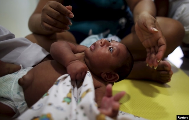 Gustavo Henrique who is 2-months old and born with microcephaly, reacts to stimulus during an evaluation session with a physiotherapist at the Altino Ventura rehabilitation center in Recife, Brazil, Feb. 11, 2016.