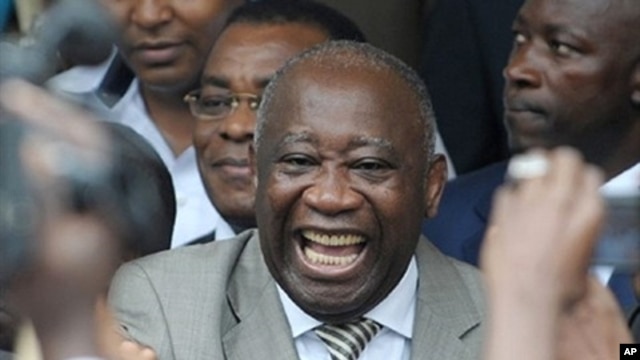 Ivory Coast President Laurent Gbagbo (center) with supporters in Abidjan after he submitted his candidacy for presidential election, 16 October 2009