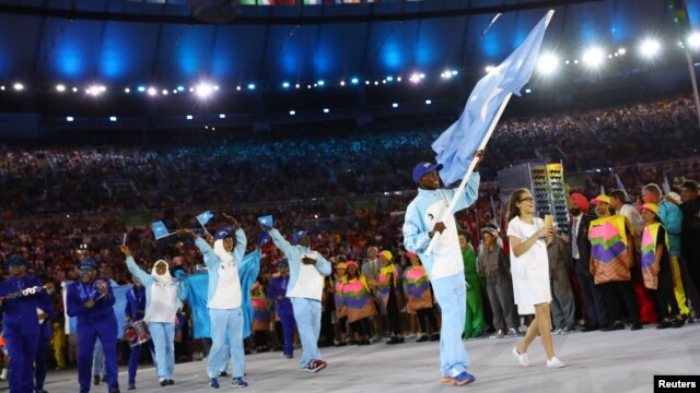 Flag-bearer Mohamed Daud Mohamed of Somalia leads his contingent during the opening ceremony at the 2016 Rio Olympics in Rio de Janeiro, Brazil, Aug. 5, 2016.