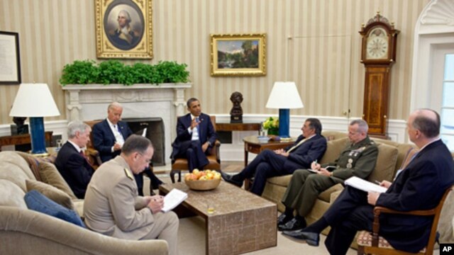 President Barack Obama and Vice President Joe Biden meet with, clockwise from the President, Defense Secretary Leon Panetta, Lieutenant General John Allen, National Security Advisor Tom Donilon, Chairman of the Joint Chiefs of Staff Admiral Mike Mullen, a