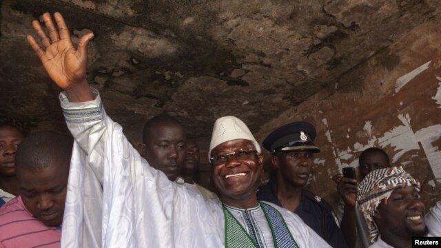 Sierra Leone's incumbent President Ernest Bai Koroma waves to supporters after voting in the capital, Freetown, November 17, 2012.