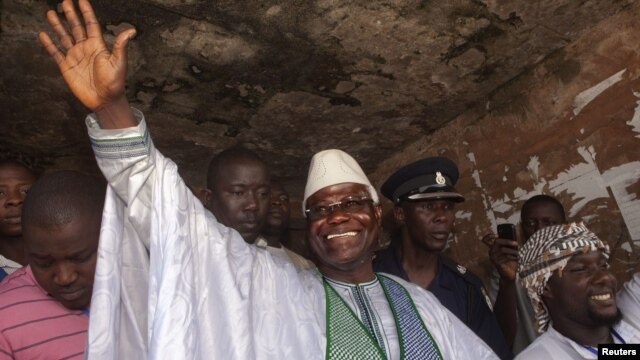 Sierra Leone's incumbent President Ernest Bai Koroma waves to supporters after voting in the capital, Freetown, November 17, 2012.